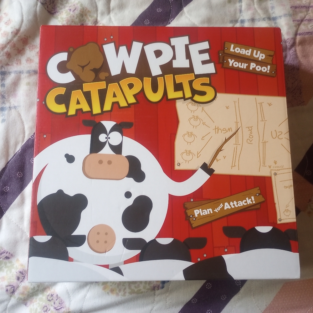 Cow pie catapult game